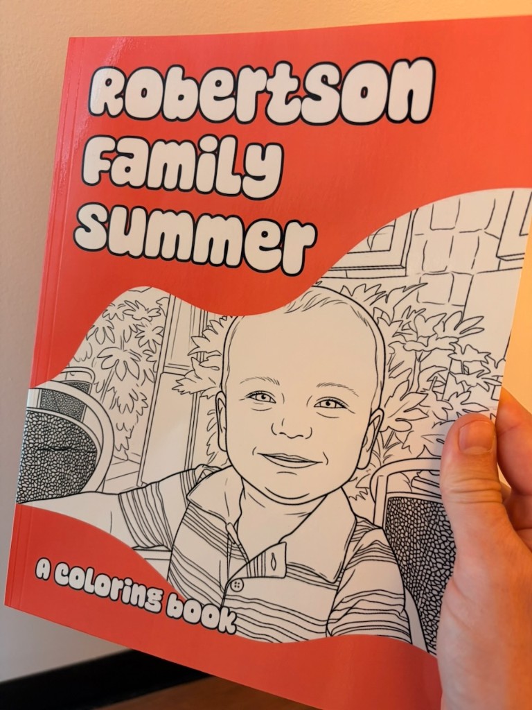 Printed red cover of Robertson Family Summer, a coloring book with a toddler line art portrait